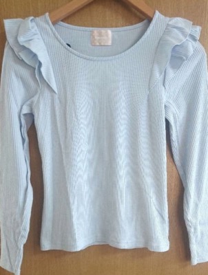 Emsexcite(エムズエキサイト)ライトブルーのフリルトップス