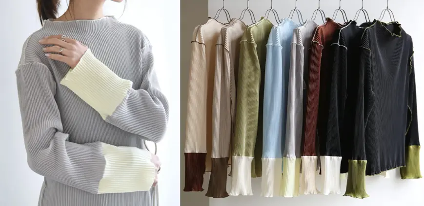 ライトグレーの袖配色プリーツニット