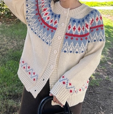 nyomアイボリーのノルディック柄カーディガン